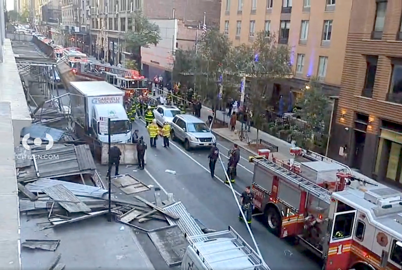 Video shows a pile of rubble where the sidewalk shed used to be as the FDNY and NYPD respond to the scene
