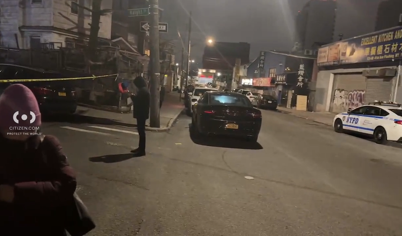 Police are seen at the shooting scene