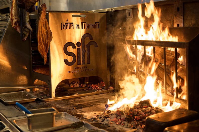 Sifr's 9-foot-wide grill was made especially for the restaurant by the Atlanta-based Grills by Damant. The woodfire grill serves as the backbone for the restaurant's Middle Eastern fare.
