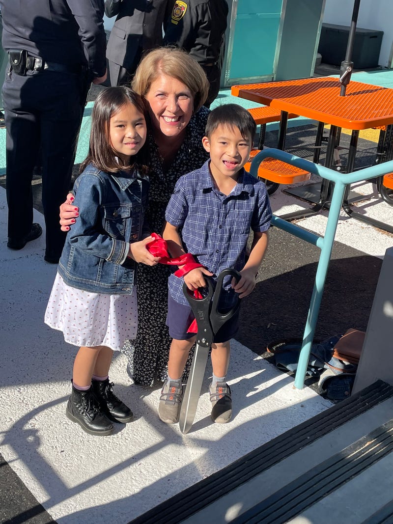 Sloane, Mrs. Shaw, and Owen at the tiny home ribbon cutting
