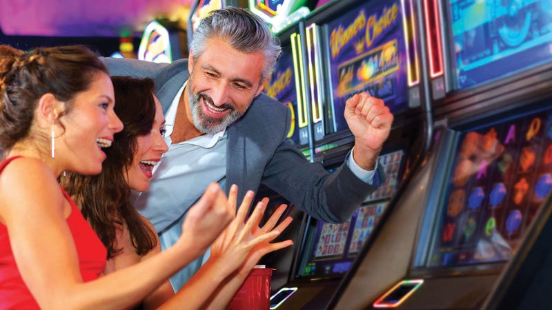People playing at a slot machine