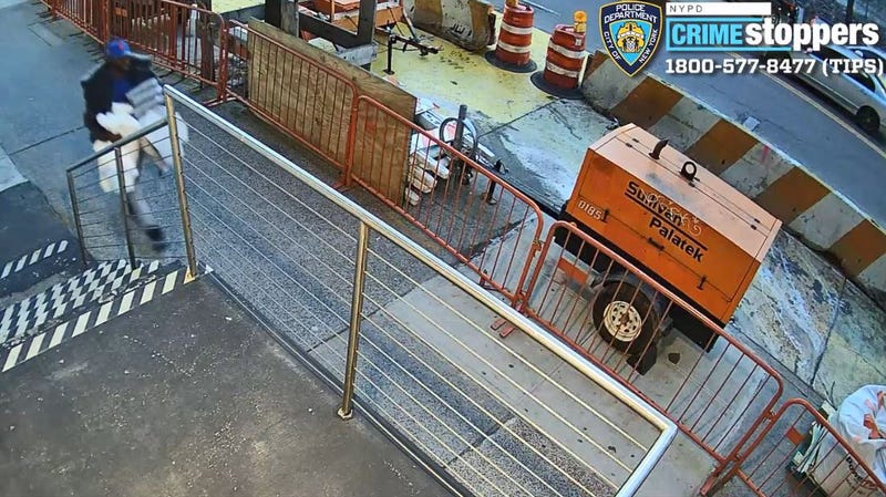A man seen walking in upper Manhattan after allegedly stealing goods from a Snipes store.