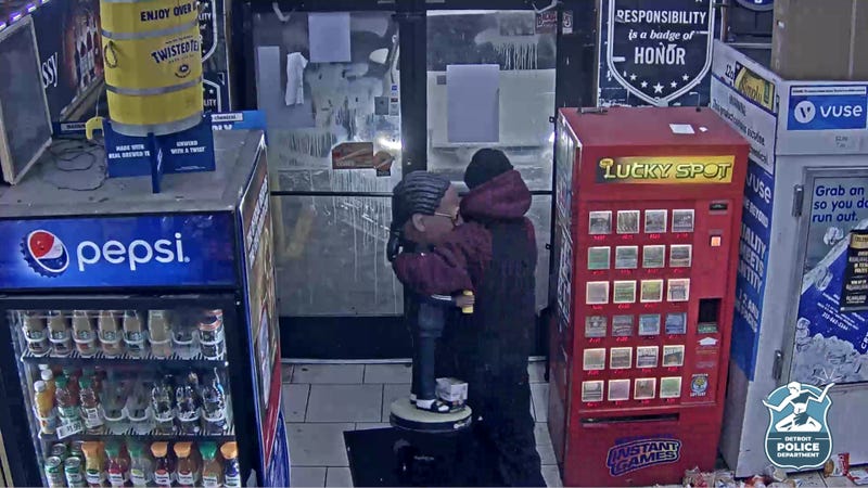 Man walking out of store with Snoop Dogg bobblehead