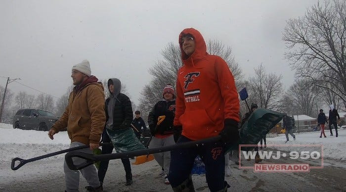 Livonia high school students spent their snow day giving back to their community by joining forces and digging out hundreds of local homeowners after Winter Storm Landon.
