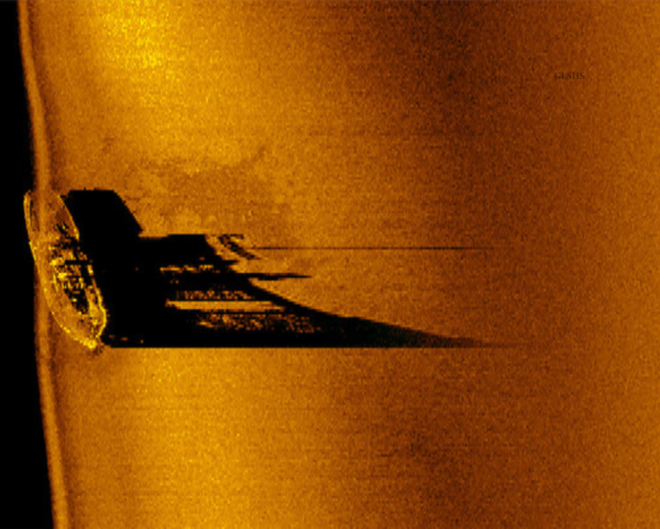 A sepia-toned sonar image of the Satellite tugboat on the bottom of Lake Superior