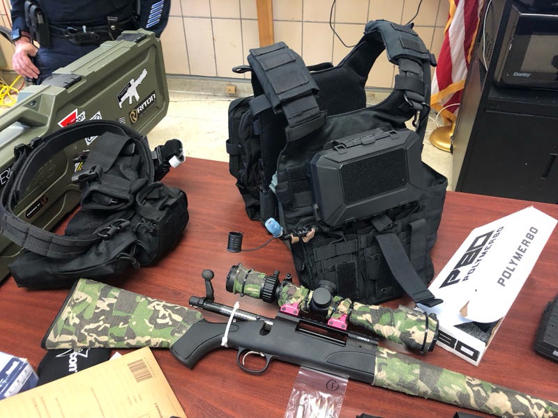 The Queens District Attorney's Office displayed the Flushing man's weapons arsenal and high-tech accessories.