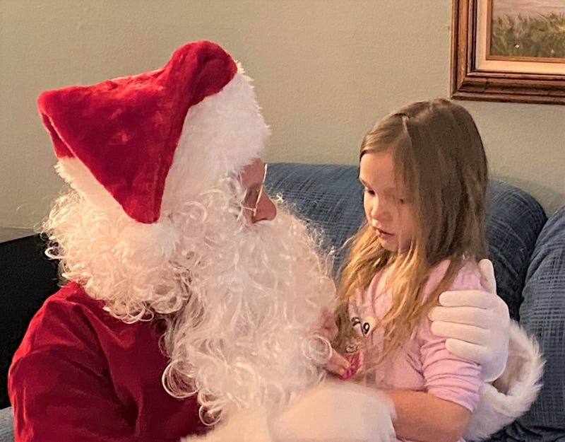 Dan Green aka Santa with daughter Emily who has autism