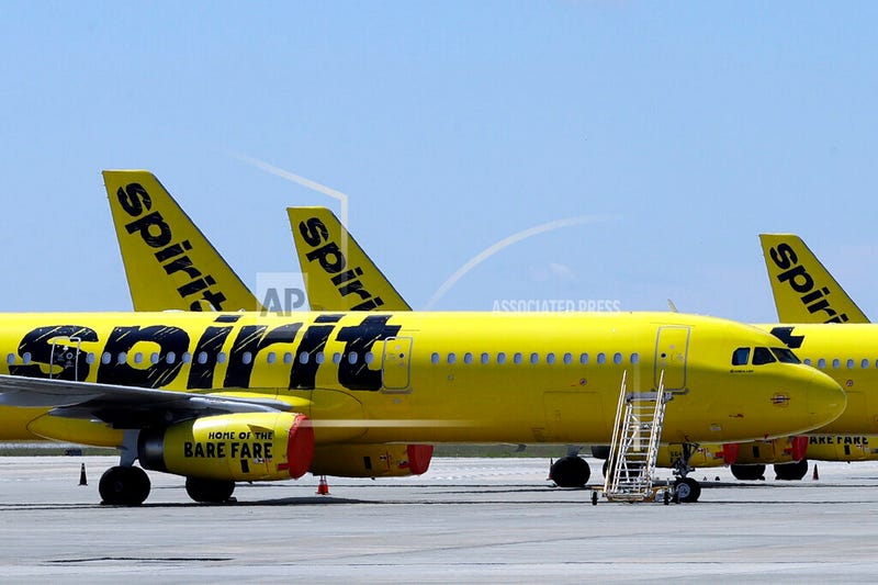 A line of Spirit Airlines jets sit on the tarmac at Orlando International Airport on May 20, 2020, in Orlando, Fla.