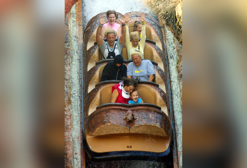 People scream as they ride on the Splash Mountain ride in 2001.
