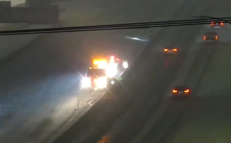 One of Minnesota's troopers assisting a driver during Wednesday morning's snow storm.