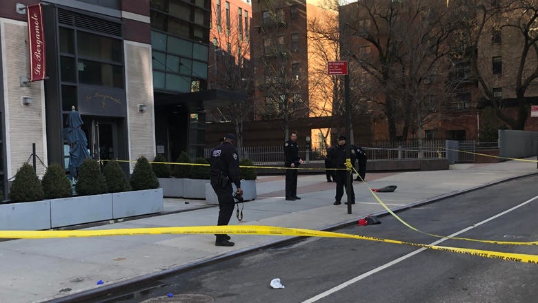 Police investigate shooting that injured a sanitation worker in Hell's Kitchen on Feb. 10, 2022.
