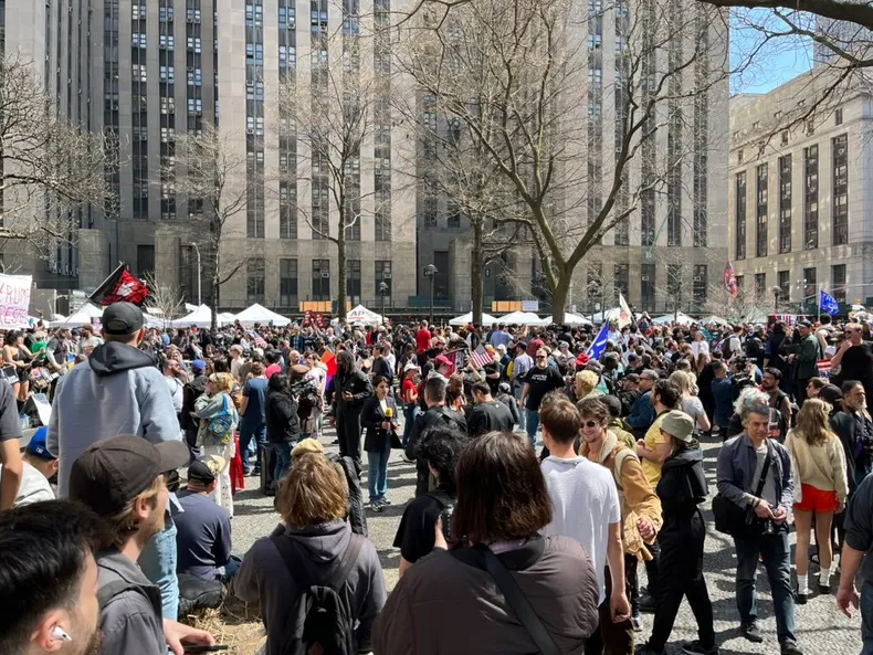 Hundreds gather at Collect Pond Park near the courthouse ahead of former President Donald Trump's arraignment hearing on April 04, 2023, in New York City