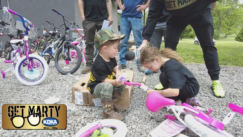 Putting bikes together ahead of the free giveaway on June 25th.