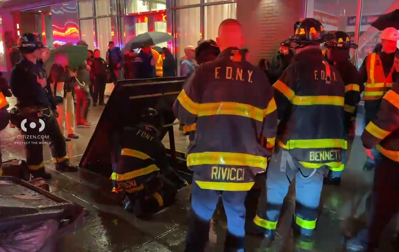 Members of the FDNY rescue subway riders from a service staircase in Downtown Brooklyn