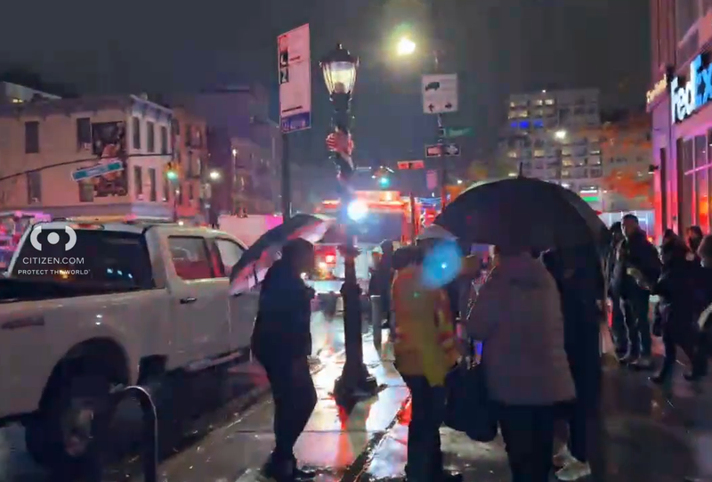 Subway riders were escorted up to the street above on a rainy night