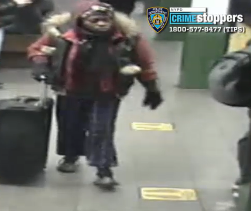 Video shows the suspect walking through the subway with a suitcase around the time of the attack on Jan. 7