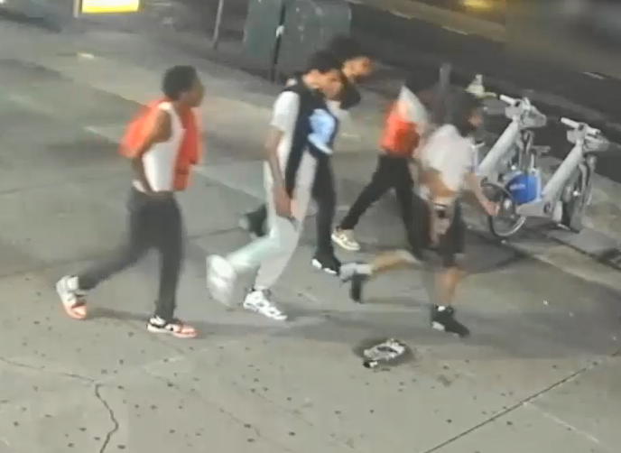 Video released by the NYPD on Wednesday shows the suspects walking down a street around the time of the assault