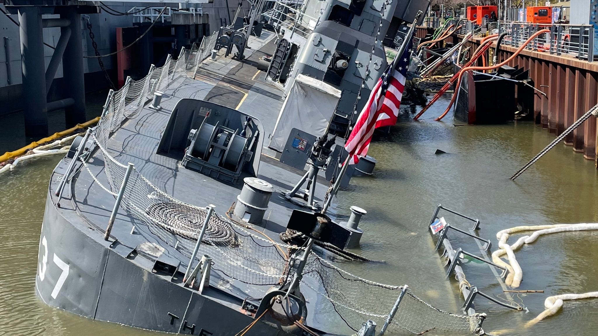 Massive effort continues to pump water and 'contaminants' from hull of USS The Sullivans