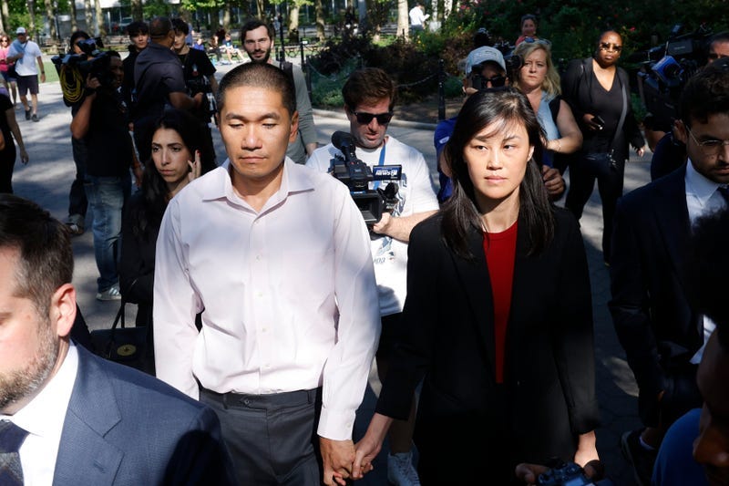 Former NY Gov. Kathy Hochul aide Linda Sun (R), and her husband (L), Christopher Hu, leave Brooklyn Federal Court after their arraignment, Tuesday, Sept. 3, 2024, in New York. Sun is charged with being an aide to the Chinese government.