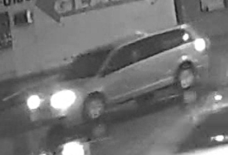 Minivan caught on black-and-white surveillance camera