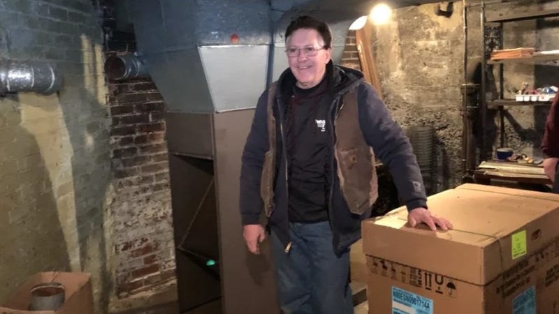 TUDI worker installing furnace