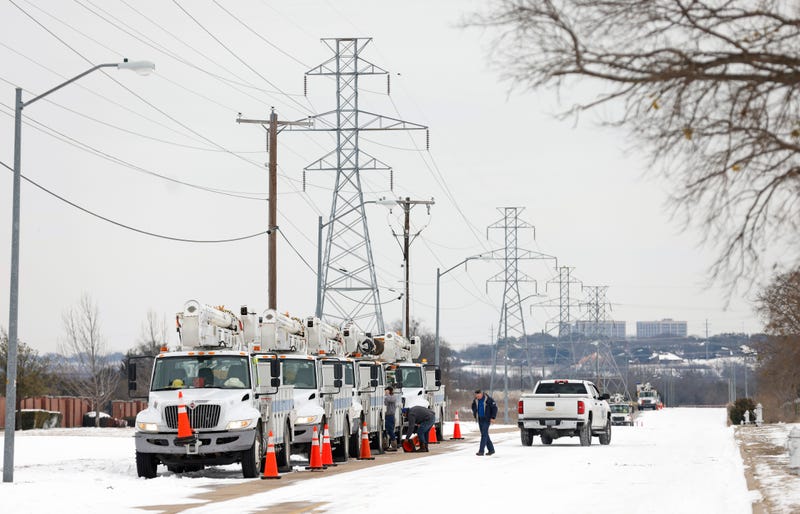 Power company trucks lined up in frigid Fort Worth, TX.