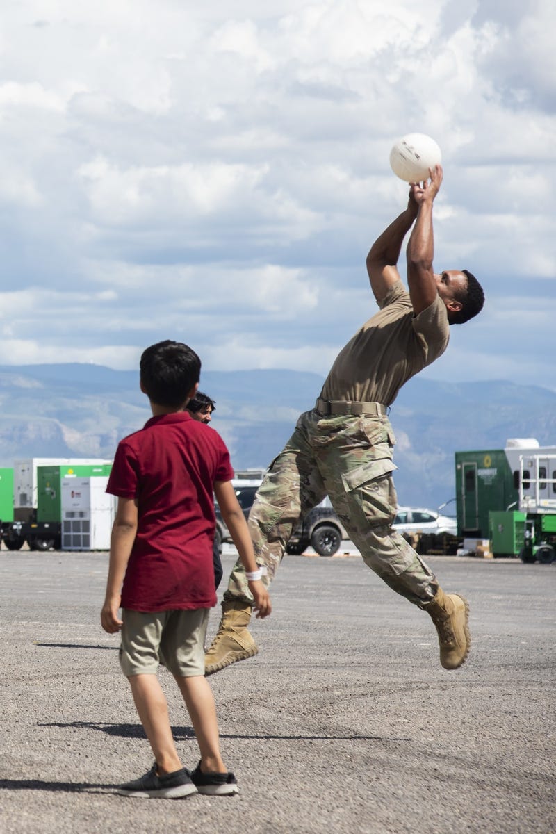 Soldiers playing with Afghan kids