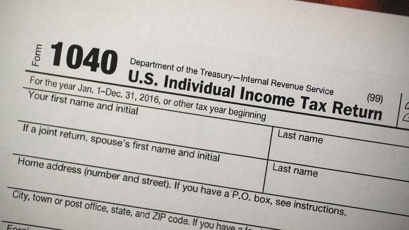  A copy of a IRS 1040 tax form is seen at an H&R Block office on the day President Donald Trump signed the Republican tax cut bill in Washington, DC on December 22, 2017 in Miami, Florida. 