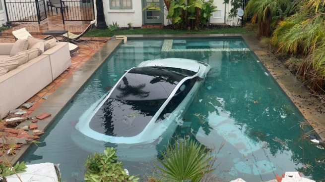 Three people rescued after Tesla drives into Pasadena pool