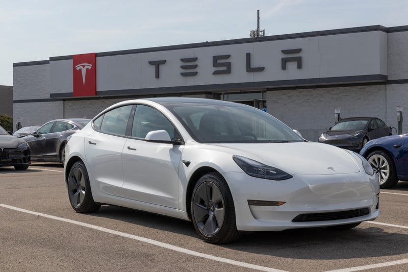 Teslas parked at a dealership