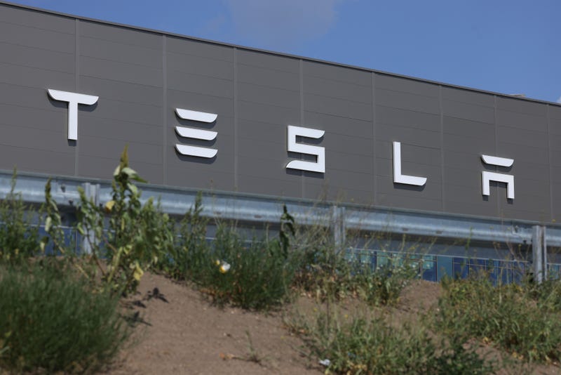 The sign outside of a Tesla manufacturing plant