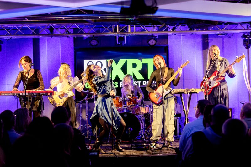 The Last Dinner Party performs at 93XRT on November 9, 2023 (l-r: Aurora Nishevci, Emily Roberts, Abigail Morris, Rebekah Rayner, Lizzie Mayland, Georgia Davies)