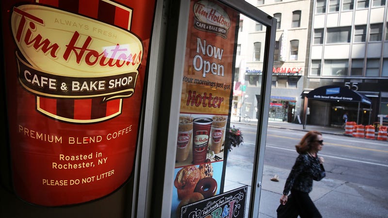 A person walks past a Tim Horton's cafe in Manhattan on August 25, 2014 in New York City.