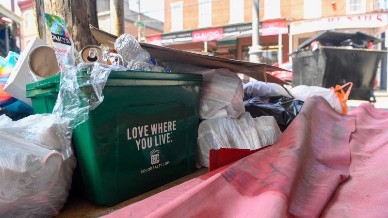 Trash piled along the sidewalks 