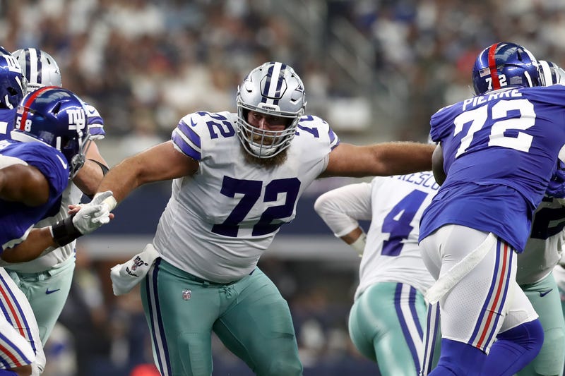 C Travis Frederick attempts to block multiple Giants defenders.