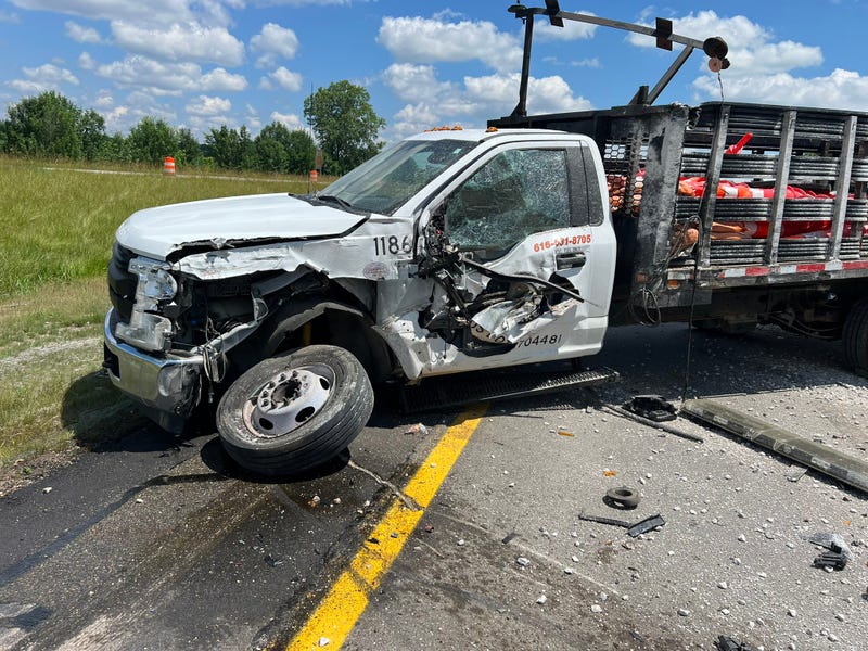 Work truck damaged by gravel hauler