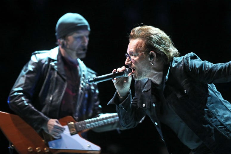 U2's Bono and The Edge perform on at the U2 eXPERIENCE + iNNOCENCE Tour