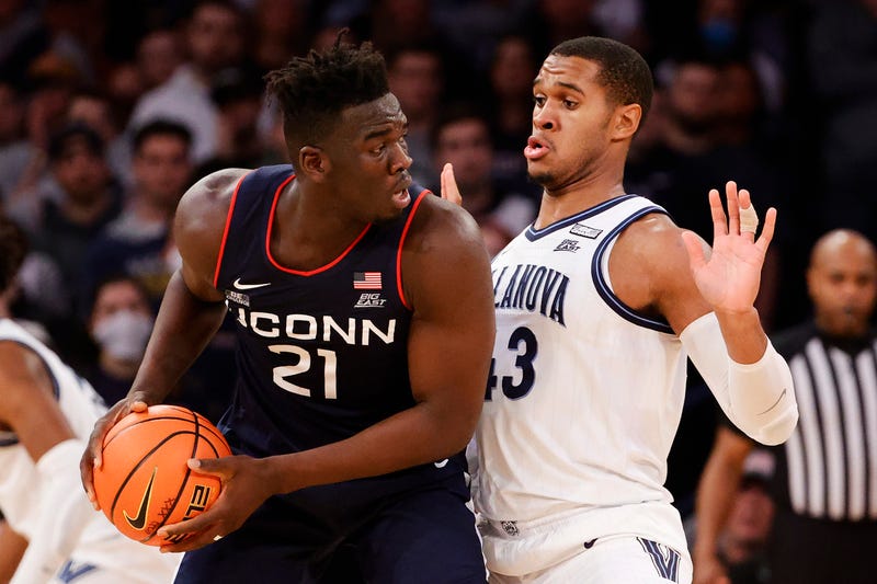 UConn's Adama Sanogo handles the ball against Villanova's Eric Dixon at the Big East Tournament in New York, 3/11/22