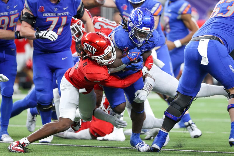 Johnathan Baldwin #3 of the UNLV Rebels tackles Ashton Jeanty #2 of the Boise State Broncos during the third quarter during the Mountain West Football Championship at Allegiant Stadium on December 02, 2023 in Las Vegas, Nevada.