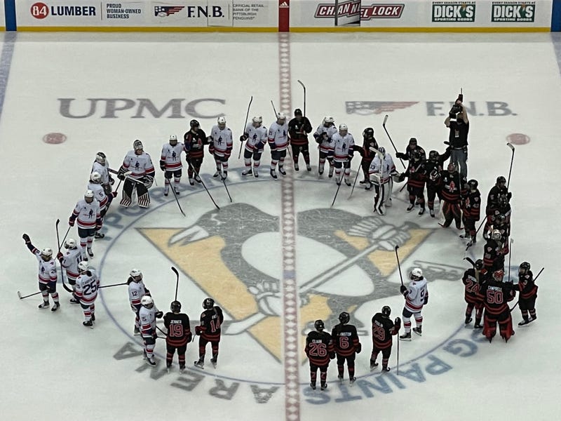 Team USA and Team Canada on ice
