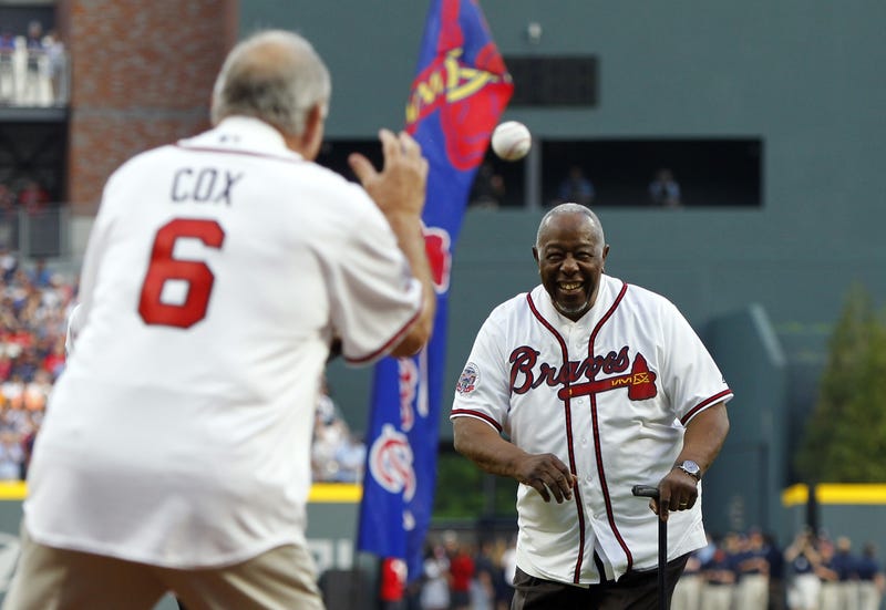 Apr 14, 2017; Atlanta, GA, USA; Atlanta Braves legend Hank Aaron throws the ceremonial first pitch to former manager Bobby Cox prior to the first MLB game at SunTrust Park.