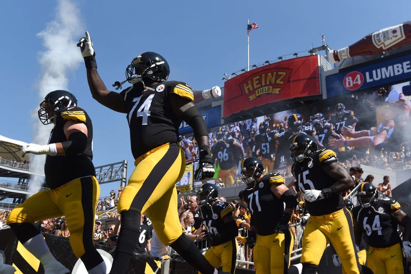Pittsburgh Steelers guard Chris Hubbard (74) points to the sky as he takes the field to play the Atlanta Falcons at Heinz Field.
