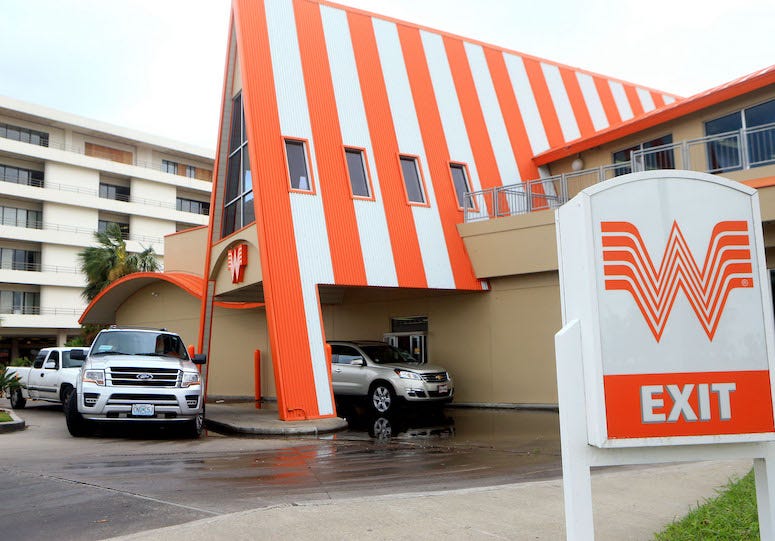Cars in drive thru line at Whataburger