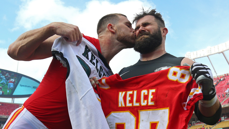 Kansas City Chiefs tight end Travis Kelce (87) kisses Philadelphia Eagles center Jason Kelce (62) on the cheek after a Sep 17, 2017, game at Arrowhead Stadium.