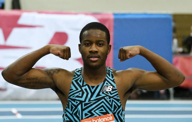 Kristian Marche flexes his biceps after winning the junior boys 60m during the New Balance Indoor Grand Prix at Reggie Lewis Center.