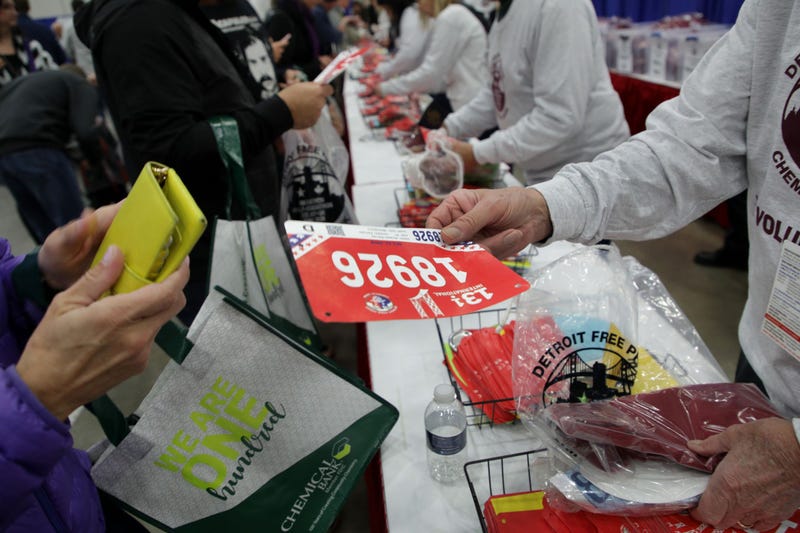 Detroit Free Press Marathon runner gets bib at Health & Fitness Expo at Huntington Place.