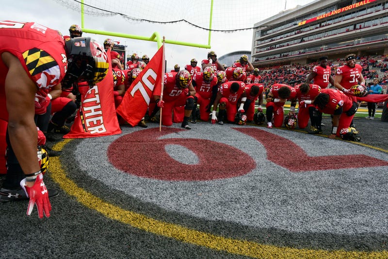 MD players pray over the number of their fallen teammate, Jordan McNair