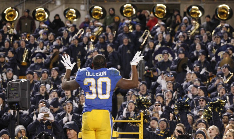 Pitt player directing band at Heinz Field