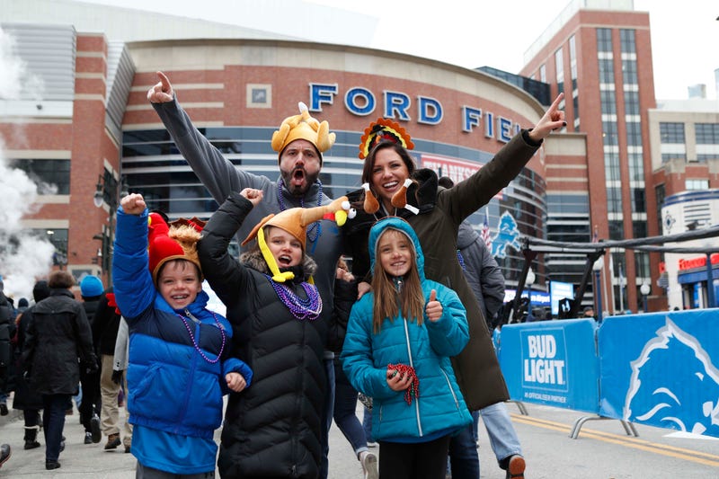 Family poses in Thanksgiving Day gear before the Detroit Lions game at Ford Field