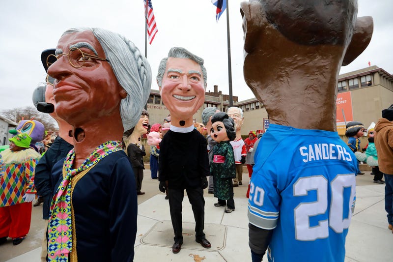 Big Heads made out of papier-mache stand outside of the Detroit Historical Museum waiting to join America's Thanksgiving Parade in Detroit